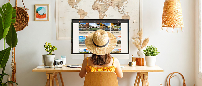 Ung girl in yellow dress browsing LULA Villas listings